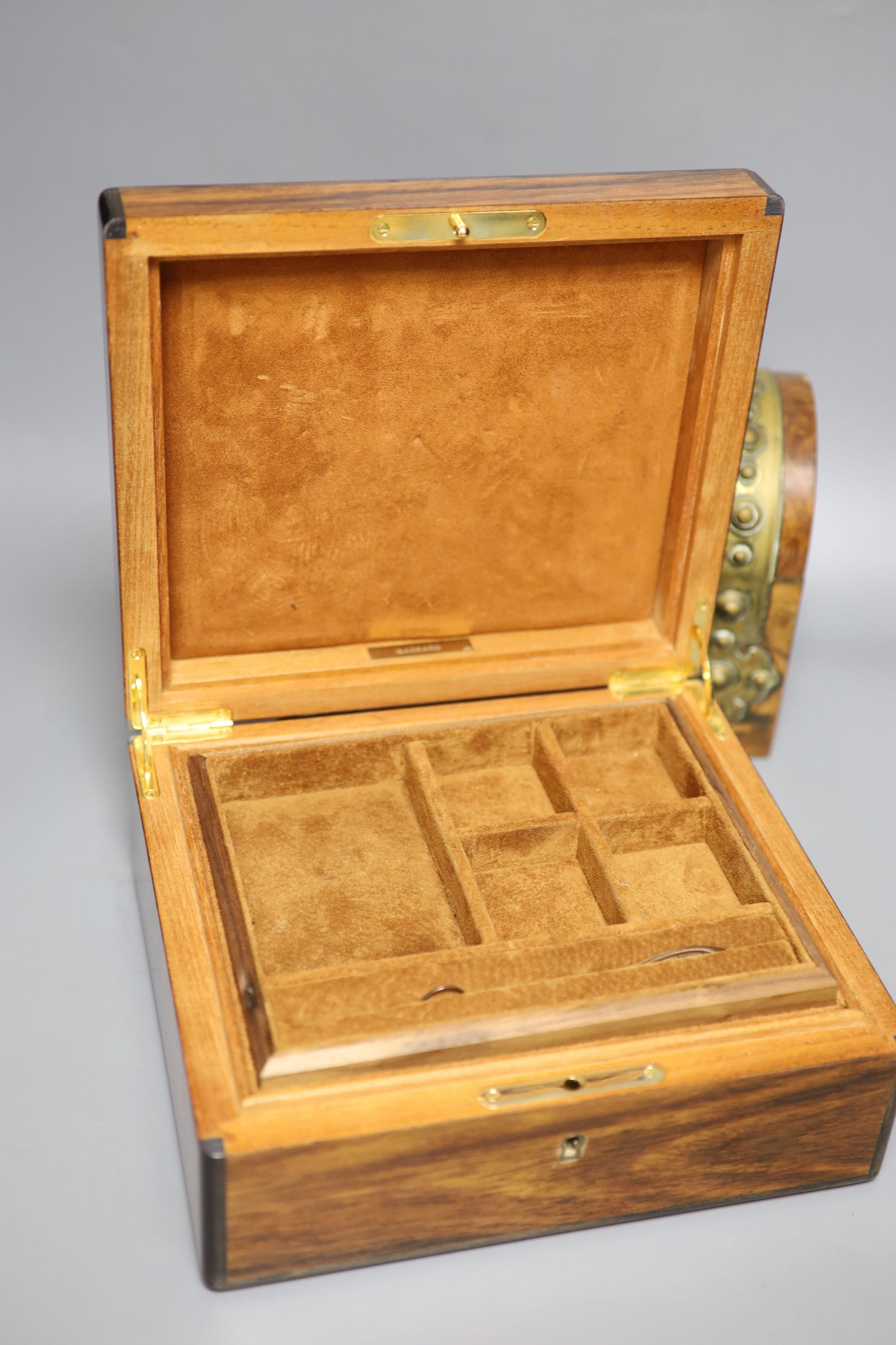 A Garrard rosewood and brass bound dome-topped box, a red leather humidor and a mahogany jewellery box